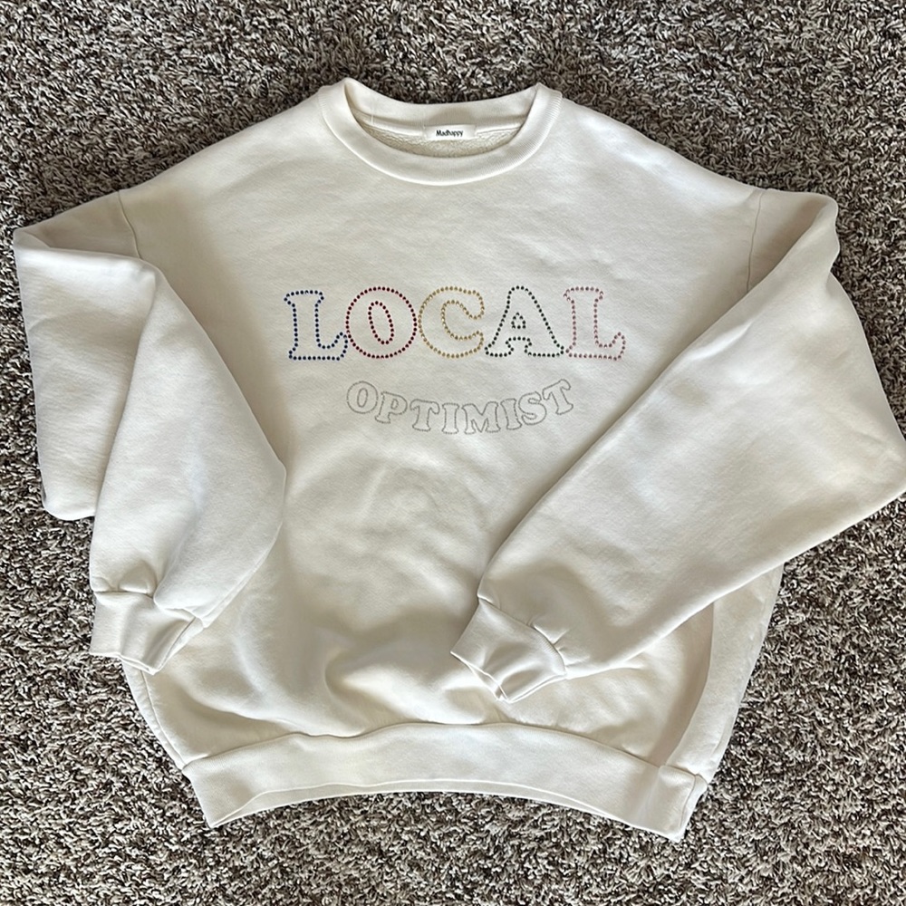 Madhappy cream sweatshirt with rainbow and silver stoning. Local optimist. Small